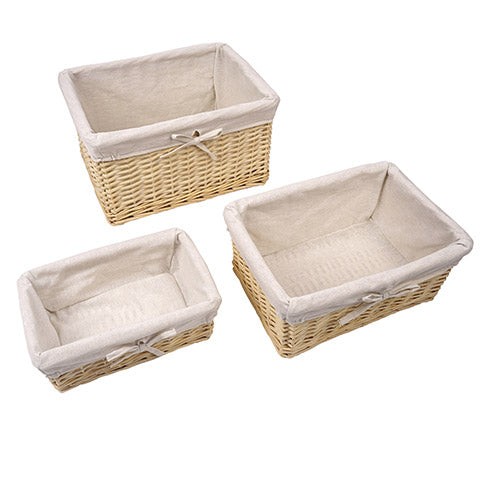 Basket set includes 3 nestled baskets with linen-style fabric that lines the interior, folding over the top edge.   Small: 9 inch wide x 12 inches long x 4 inches deep Medium: 10 inches wide x 14 inches long x 6 inches deep  Large: 12 inches wide x 16 inches long x 9 inches deep 