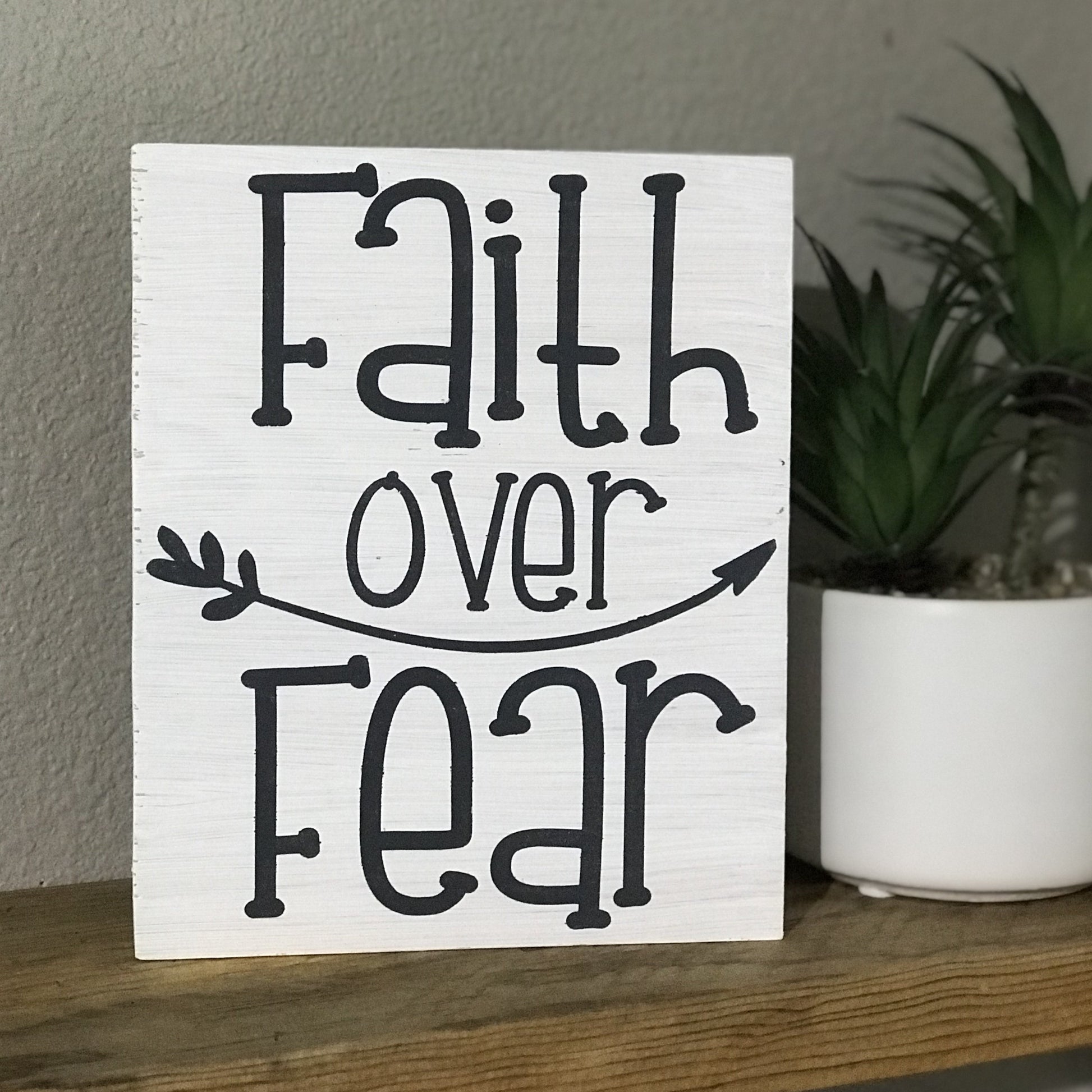 Measures approx. 7 1/4 inch x 6 inch Background painted in white  Saying "Faith over Fear" in gray
